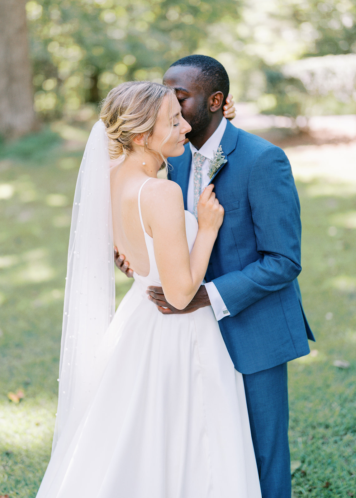 North Carolina Wedding couple romantically kiss under the trees