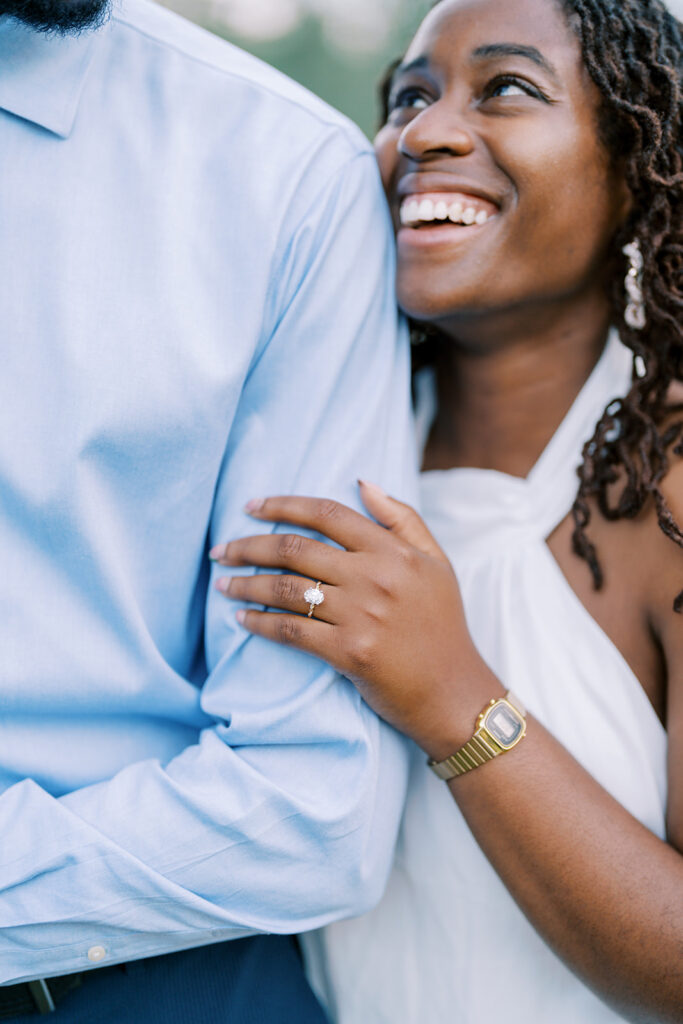A close-up capturing Agnes’s engagement ring as she looks lovingly up at Uzo during their session at Union Grove Barn in Chapel Hill, North Carolina, photographed by Durham wedding photographer Jessica Leigh Mason.