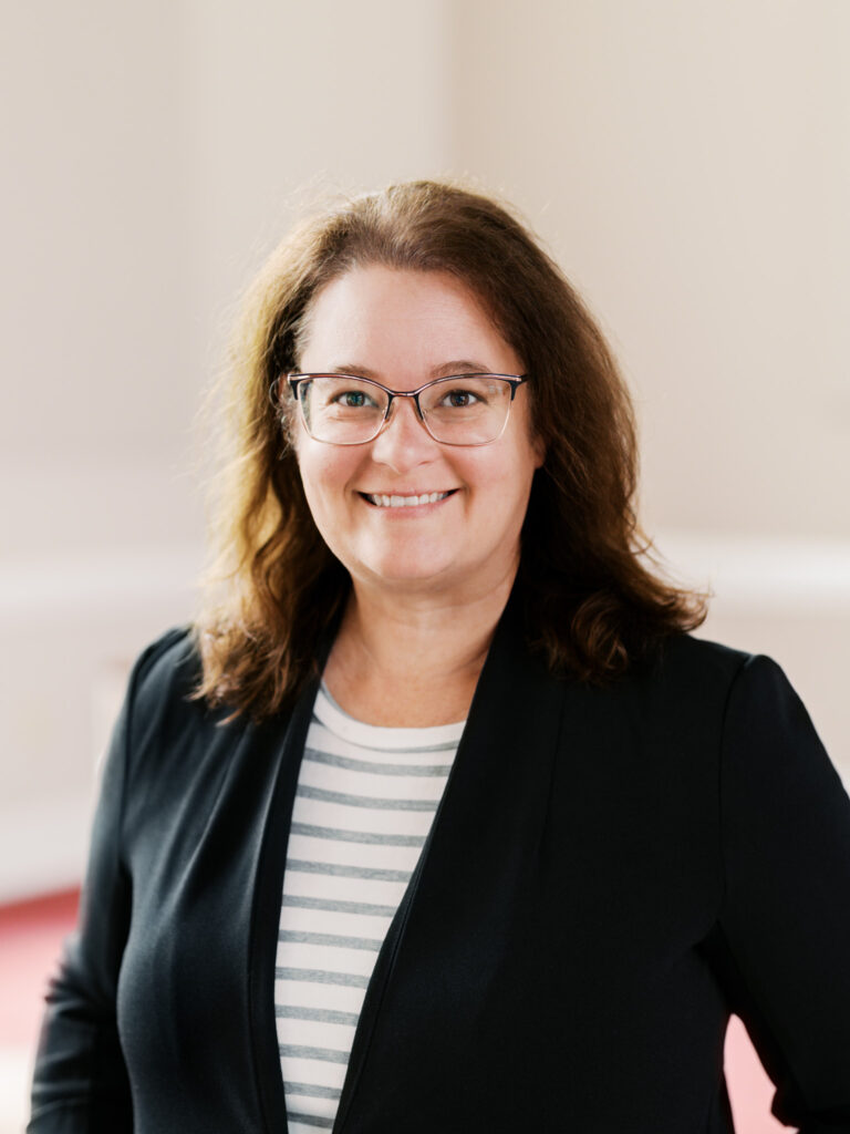 Professional headshot of a church staff member in Durham, North Carolina, capturing a confident and approachable demeanor.