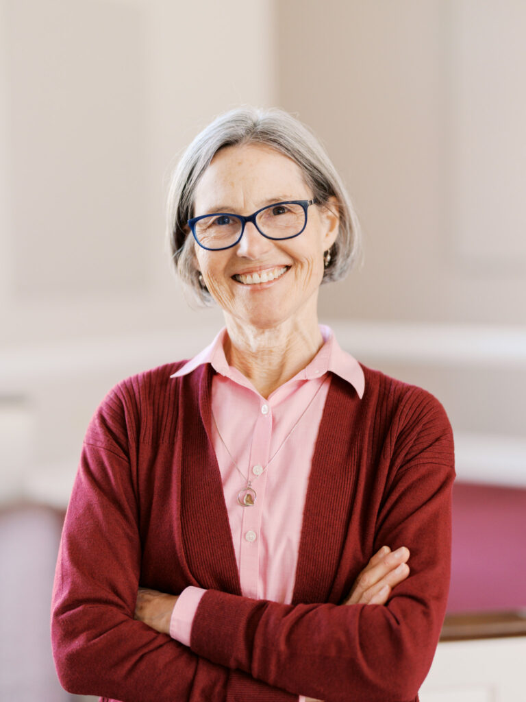 Portrait of a friendly church staff member in Raleigh, North Carolina, emphasizing approachability and professionalism.