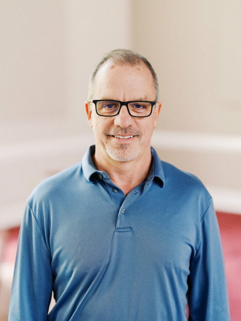 Portrait of a church staff member in Durham, North Carolina, conveying warmth, professionalism, and community focus.