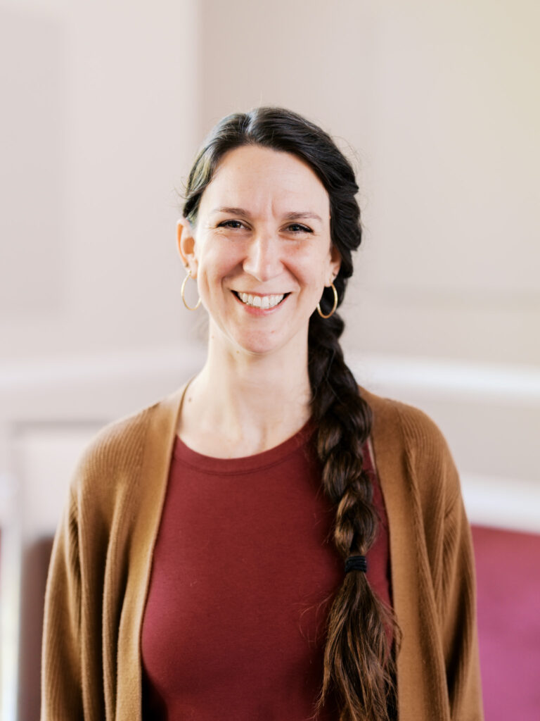 Professional headshot of a church staff member in Raleigh, North Carolina, showcasing a warm and approachable presence.