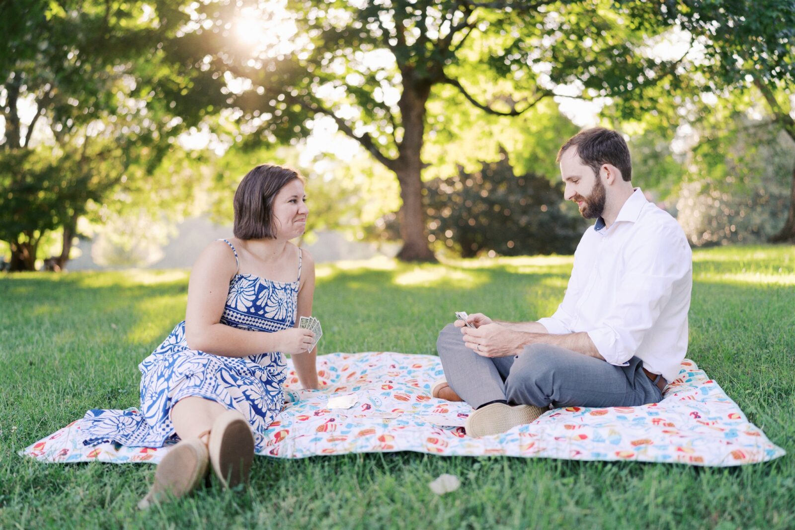 Katie and Sam playing cards and enjoying each other’s company at Ayr Mount in Hillsborough NC during their anniversary photo session.