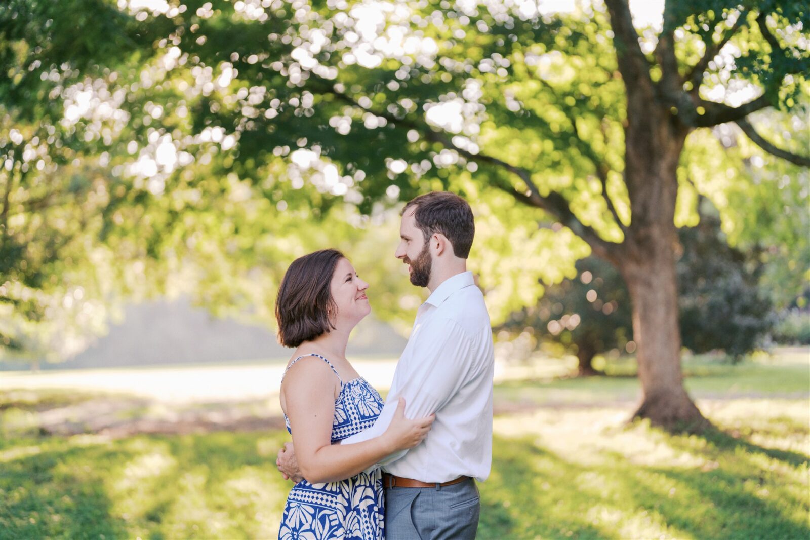 Katie and Sam standing together in a simple, elegant portrait during their anniversary photo session at Ayr Mount in Hillsborough NC.