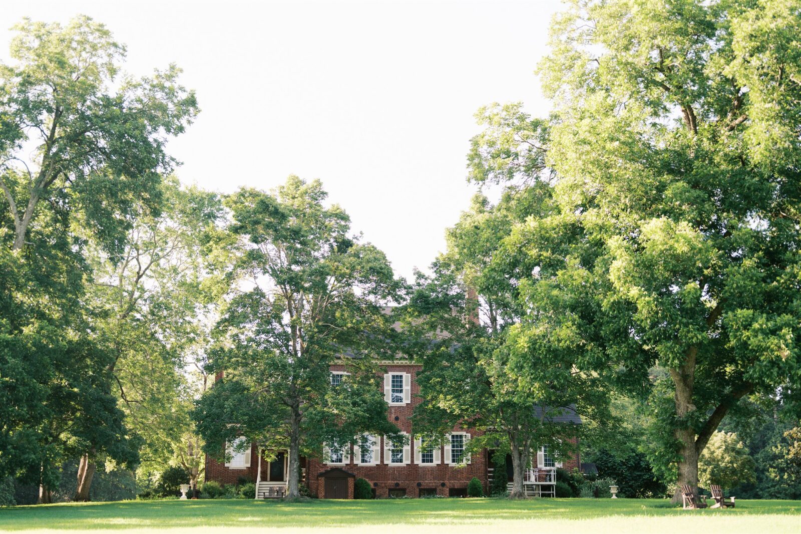 Scenic landscape of the Ayr Mount grounds with the back of the historic house visible in Hillsborough NC, captured during Katie and Sam’s anniversary photo session.