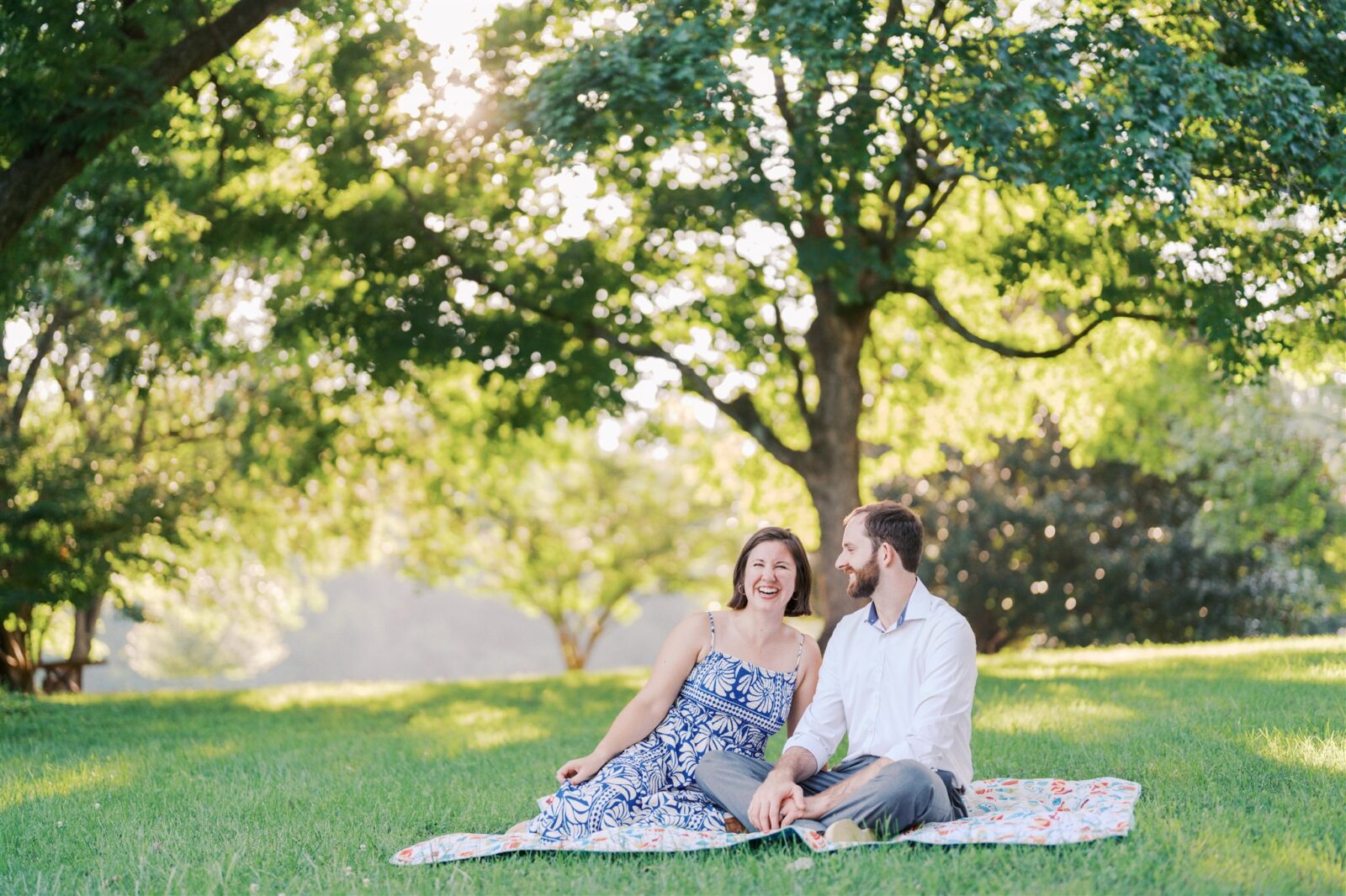 Katie and Sam laughing together and enjoying each other’s company during their anniversary photo session at Ayr Mount in Hillsborough NC.