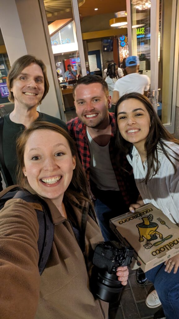 Photographers taking a selfie with Rachel and Nate after sharing dinner together in uptown Charlotte