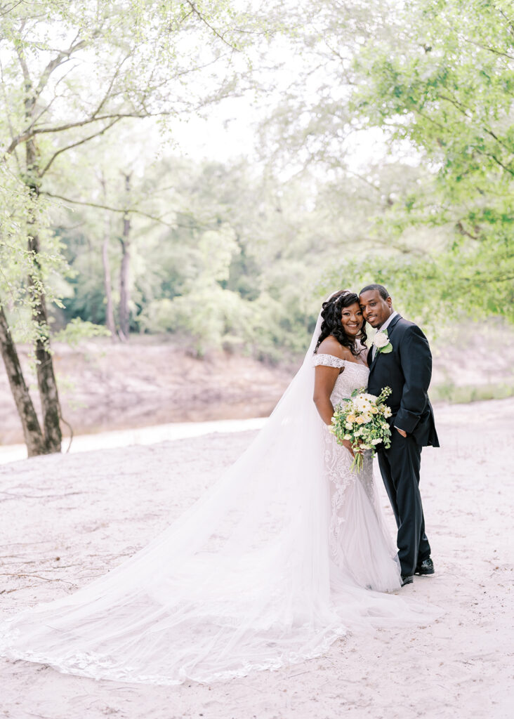 Spring wedding portraits of bride and groom at The River Lodge at River Landing