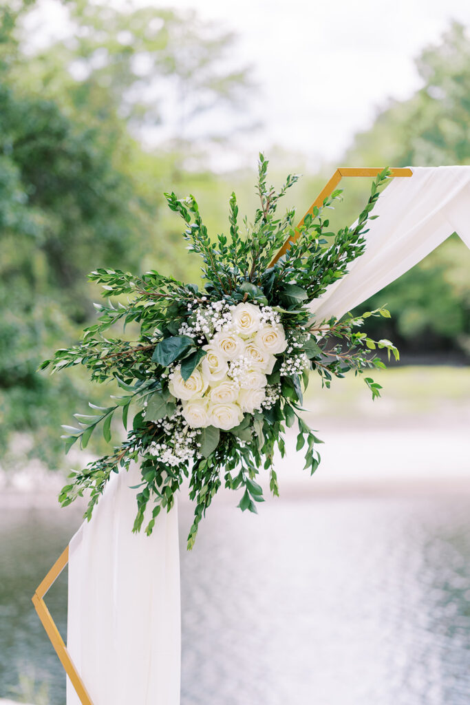 Floral and geometric arbor design for a spring wedding at River Landing