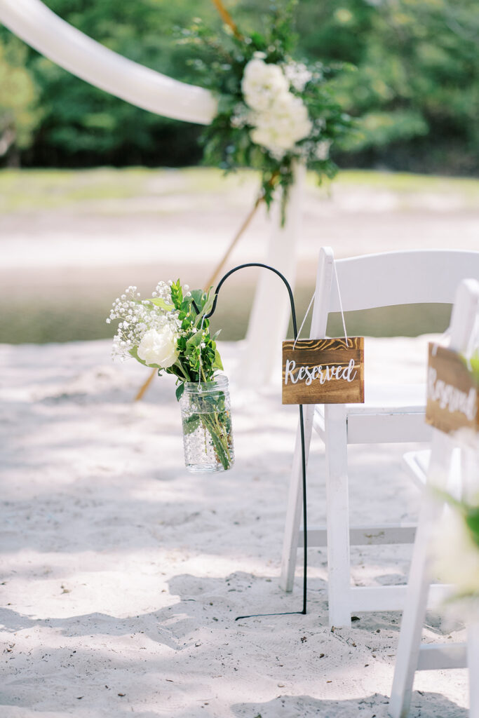 Wedding ceremony details at River Landing including floral arrangements and decor