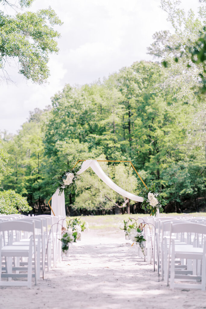 Outdoor wedding ceremony at The River Lodge at River Landing with soft spring light
