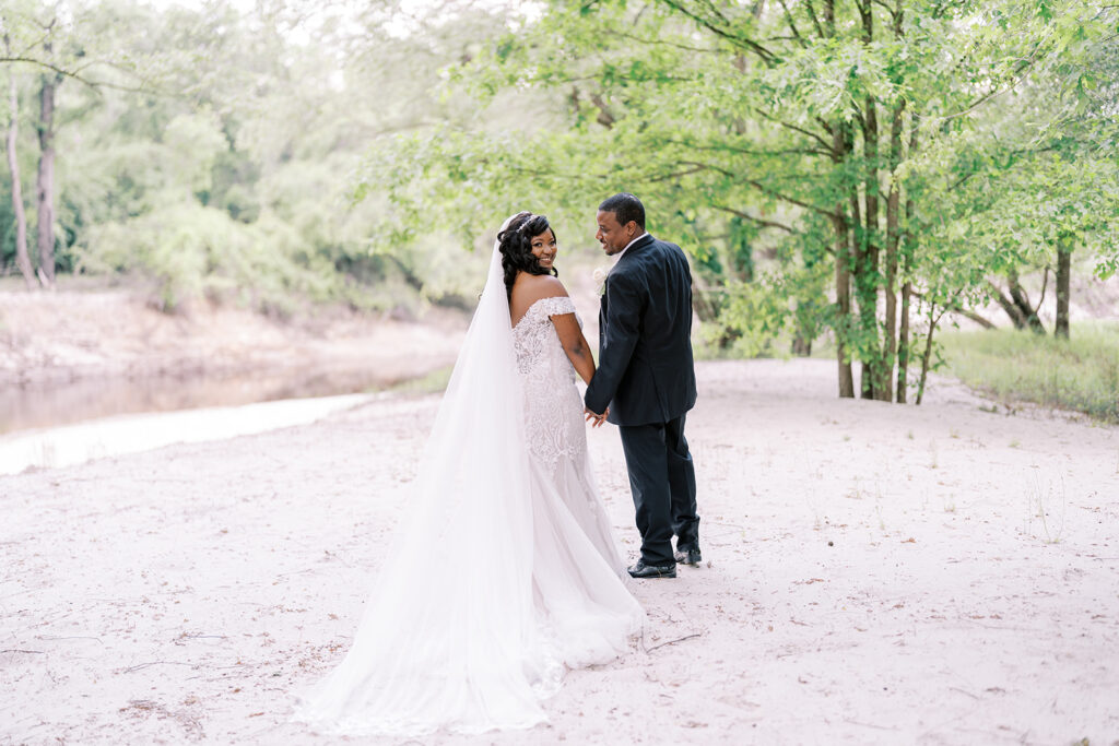 Faith-filled wedding day at River Landing photographed in soft spring light