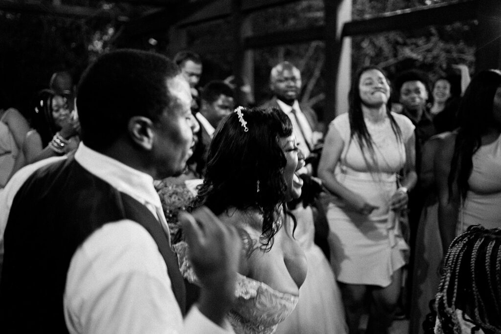 Spring wedding party dancing and celebrating at River Landing