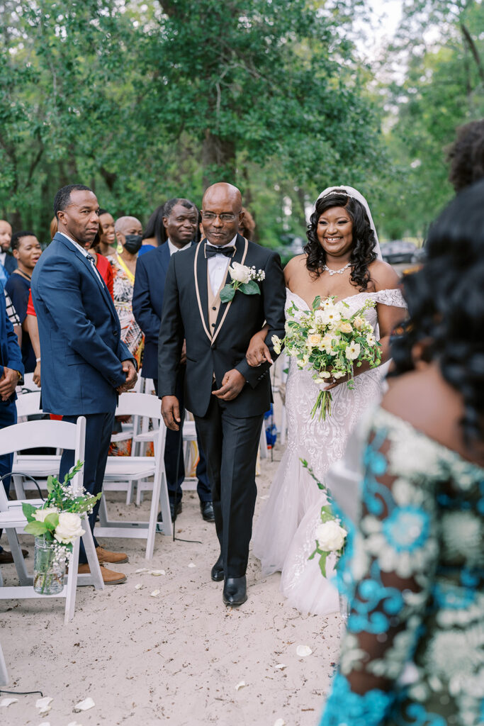 Sandy beach ceremony at River Landing photographed by a North Carolina wedding photographer