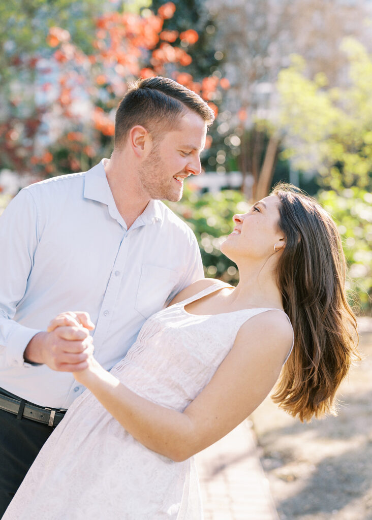 Couple sharing a quiet moment under the city’s spring blooms at Romare Bearden Park