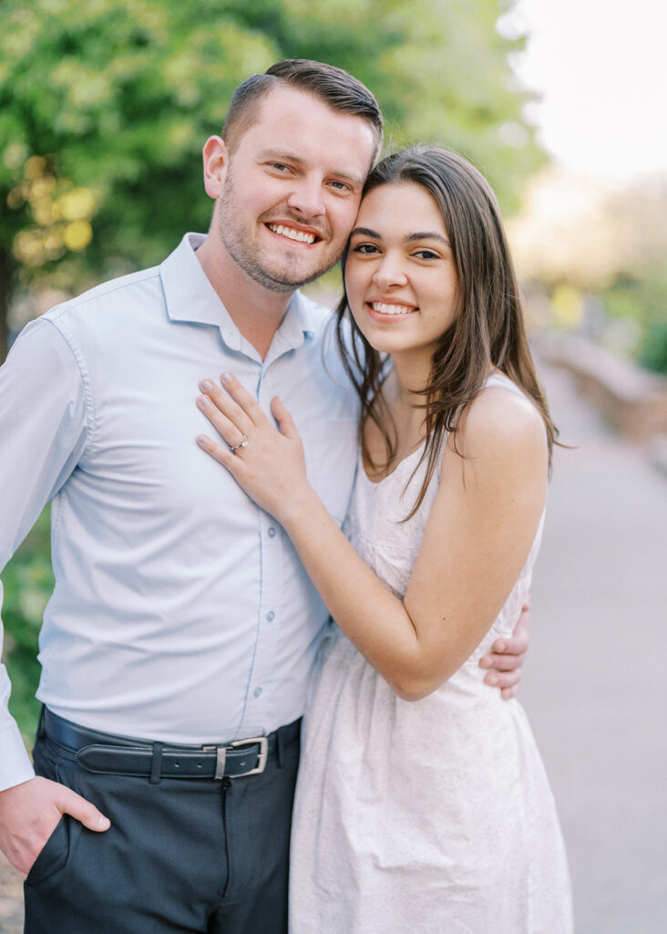 Elegant, fine art engagement portrait of Rachel and Nate in Romare Bearden Park with soft spring light