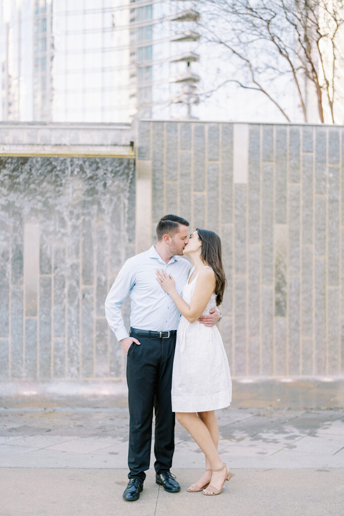 Fine art engagement portrait of a couple in uptown Charlotte, North Carolina during their spring engagement session at Romare Bearden Park