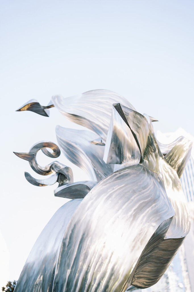 Modern sculpture at Romare Bearden Park in Charlotte, North Carolina against a bright blue sky