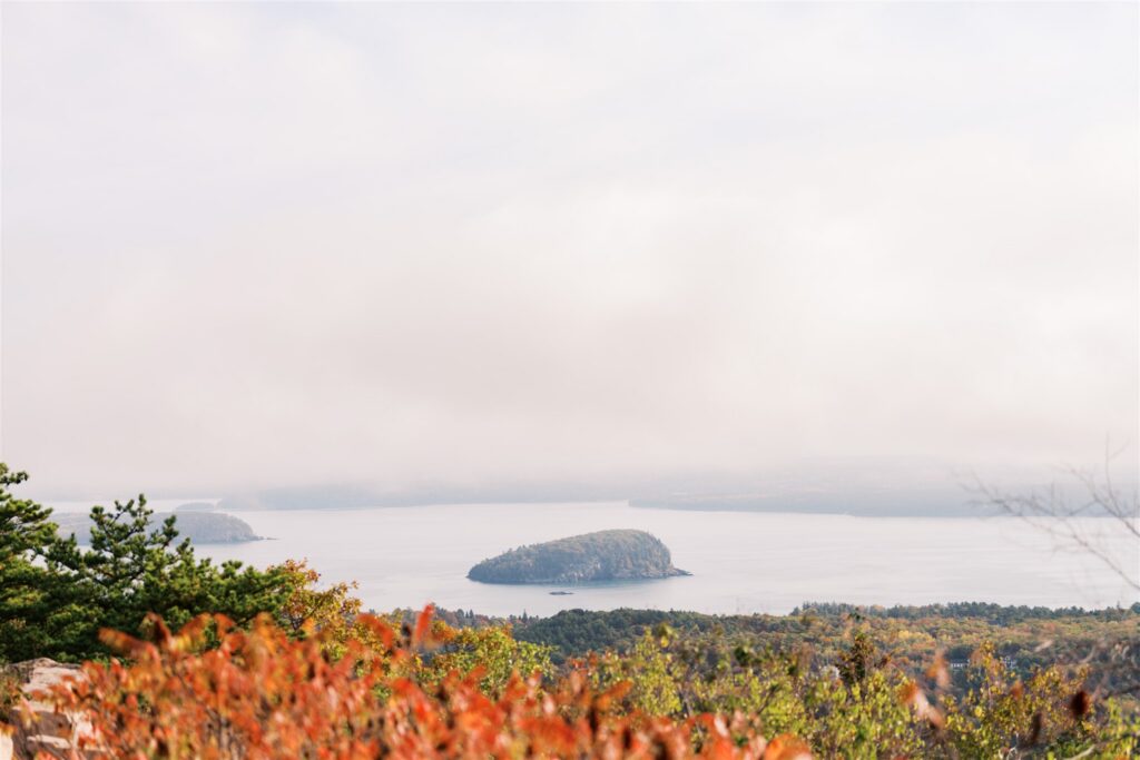 Panoramic island view from Cadillac Mountain surrounded by peak fall foliage in Acadia National Park Maine
