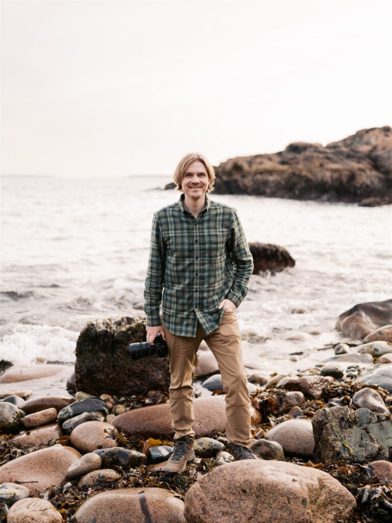 Figure taking in the evening light at Little Hunters Beach in Acadia Maine

