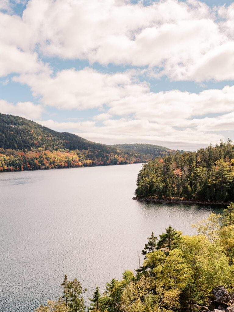 Eagle Lake reflecting vibrant fall foliage colors in Acadia National Park Maine

