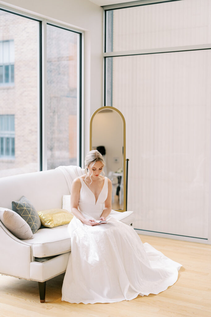 Bride reading a heartfelt letter from the groom during getting ready