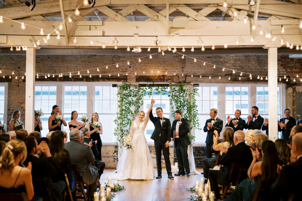 Celebratory moment as the couple is announced husband and wife at the wedding ceremony