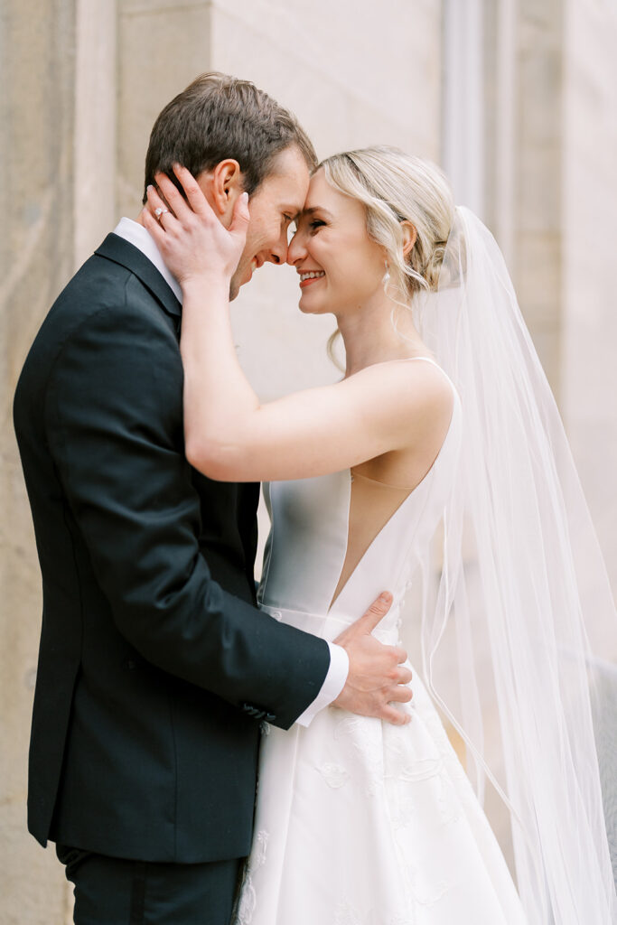 Newlyweds in clean winter light at the North Carolina State Capitol grounds in downtown Raleigh