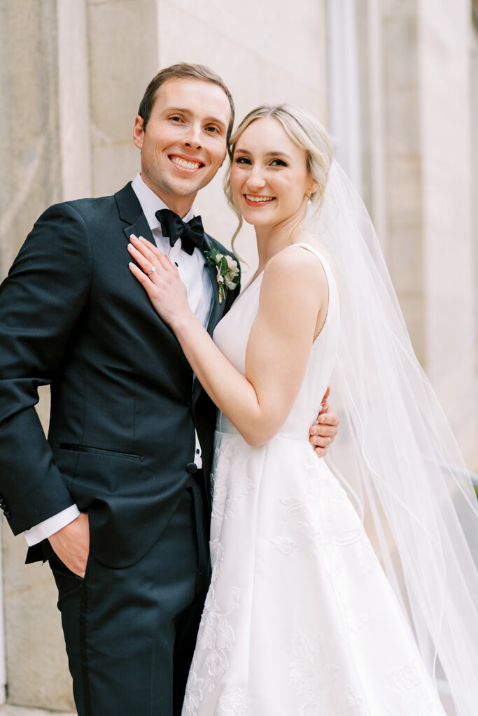 Romantic portrait of a bride and groom during their wedding day in downtown Raleigh