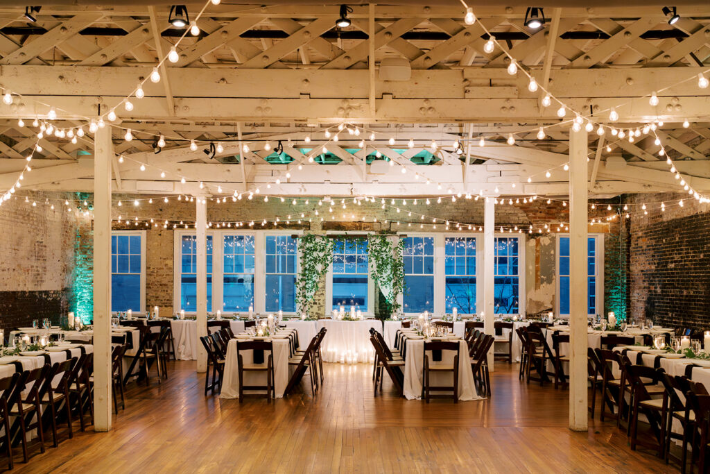 Reception space at Stockroom 230 decorated with twinkle lights for an elegant winter wedding celebration