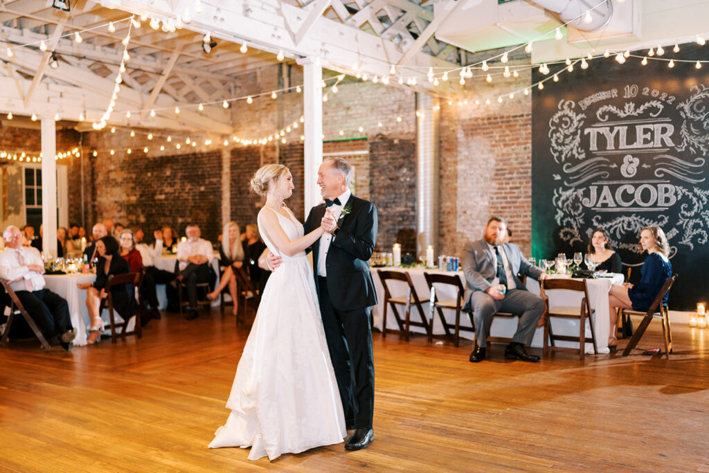 Bride dancing with her father during a wedding reception at Stockroom 230