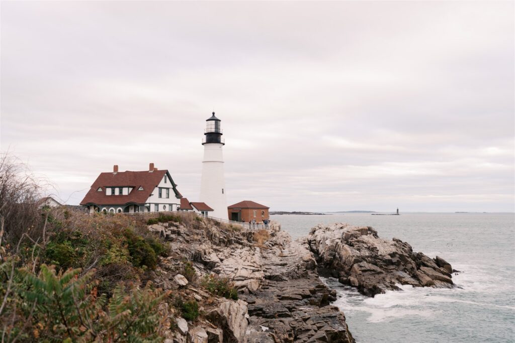 Overlooking the rugged rocky coastline of Cape Elizabeth Maine in cool soft blue tones in October