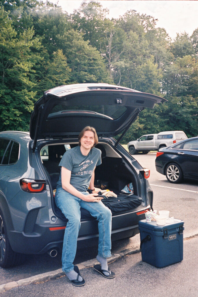 Eating breakfast from the back of our car at a campsite near Boone, NC