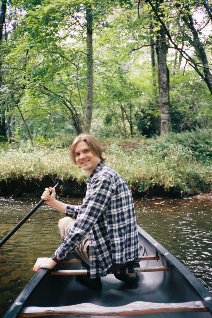 Man paddling a canoe on Price Lake near Boone, NC