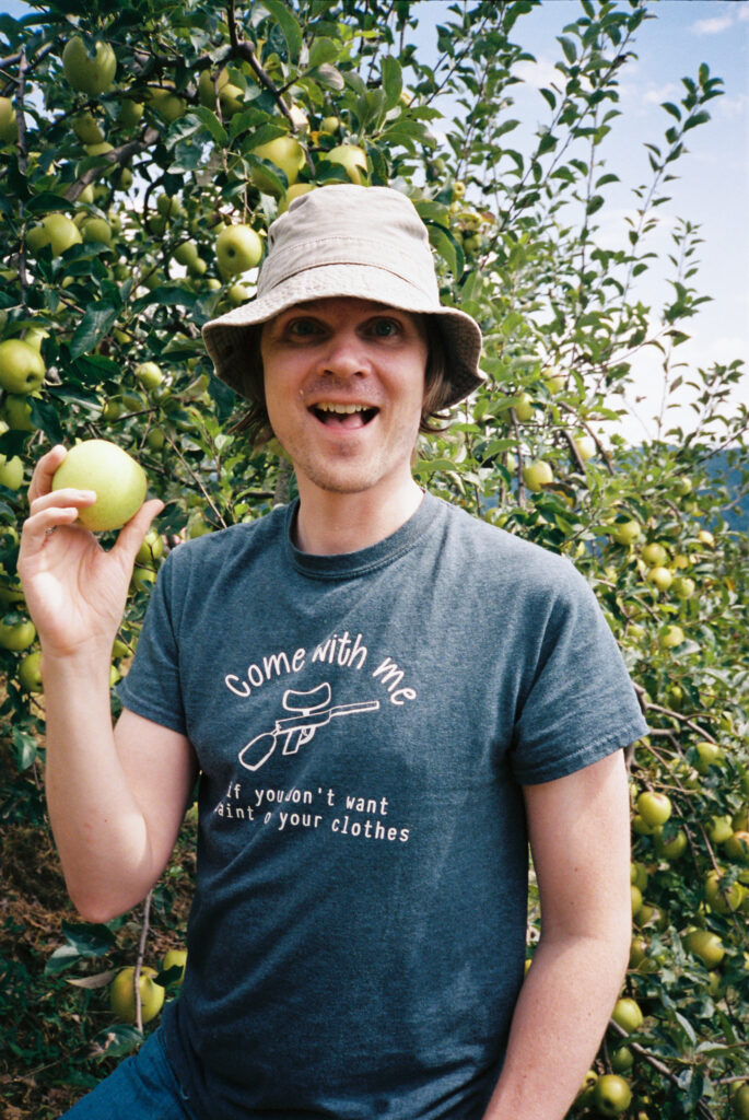 Couple picking apples at an orchard along the Blue Ridge Parkway near Boone, NC